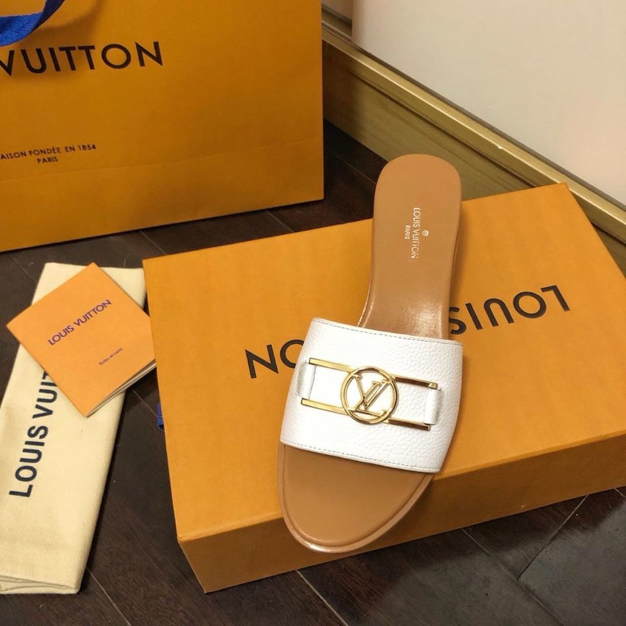 Louis Vuitton Lock It Flat Mules Calfskin Leather Spring/Summer Collection 1A64MN White