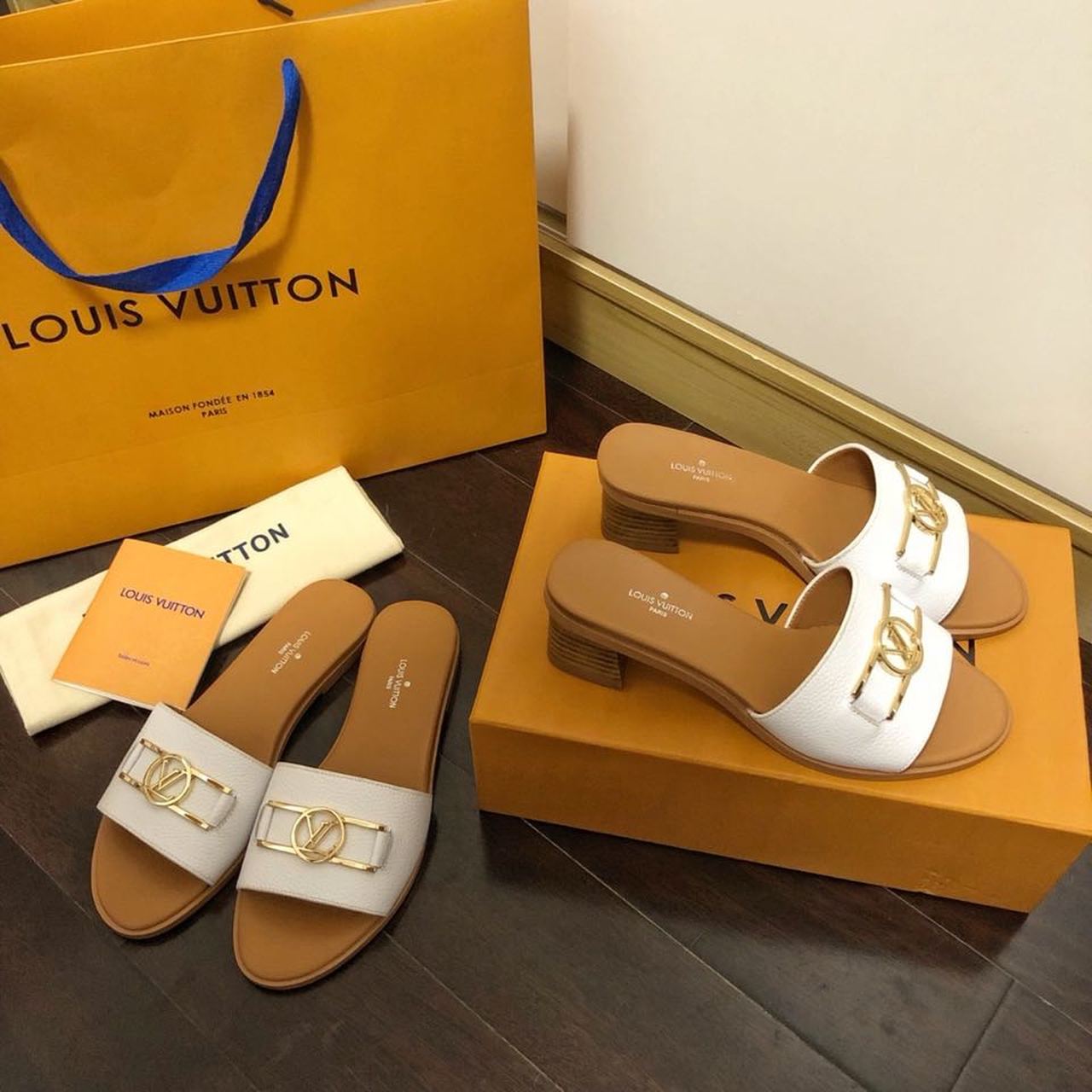 Louis Vuitton Lock It Flat Mules Calfskin Leather Spring/Summer Collection 1A64MN White