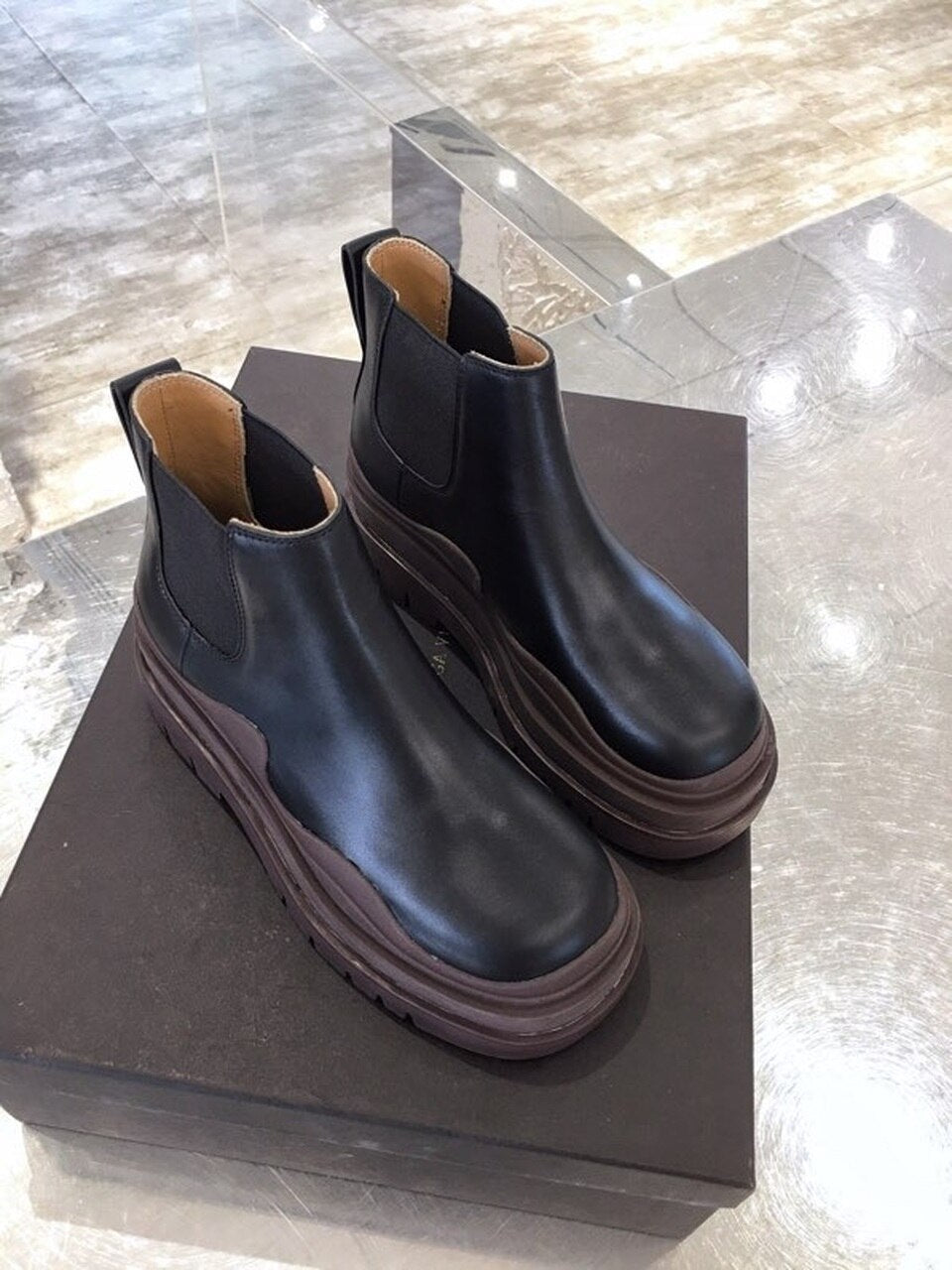 Bottega Veneta Flat Triple-Sole Leather Booties Calfskin Leather Fall/Winter 2020 Collection, Black/Brown