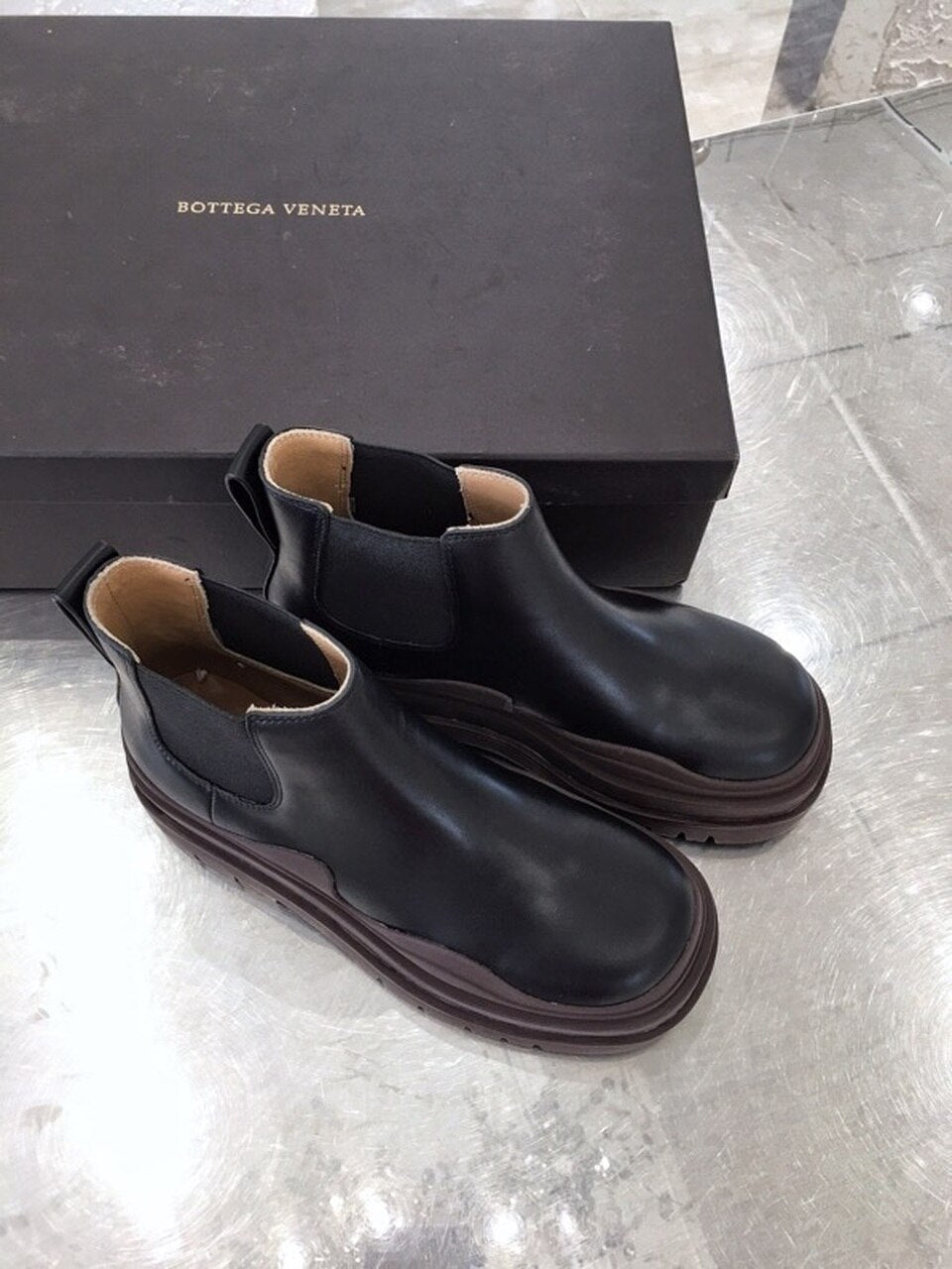 Bottega Veneta Flat Triple-Sole Leather Booties Calfskin Leather Fall/Winter 2020 Collection, Black/Brown